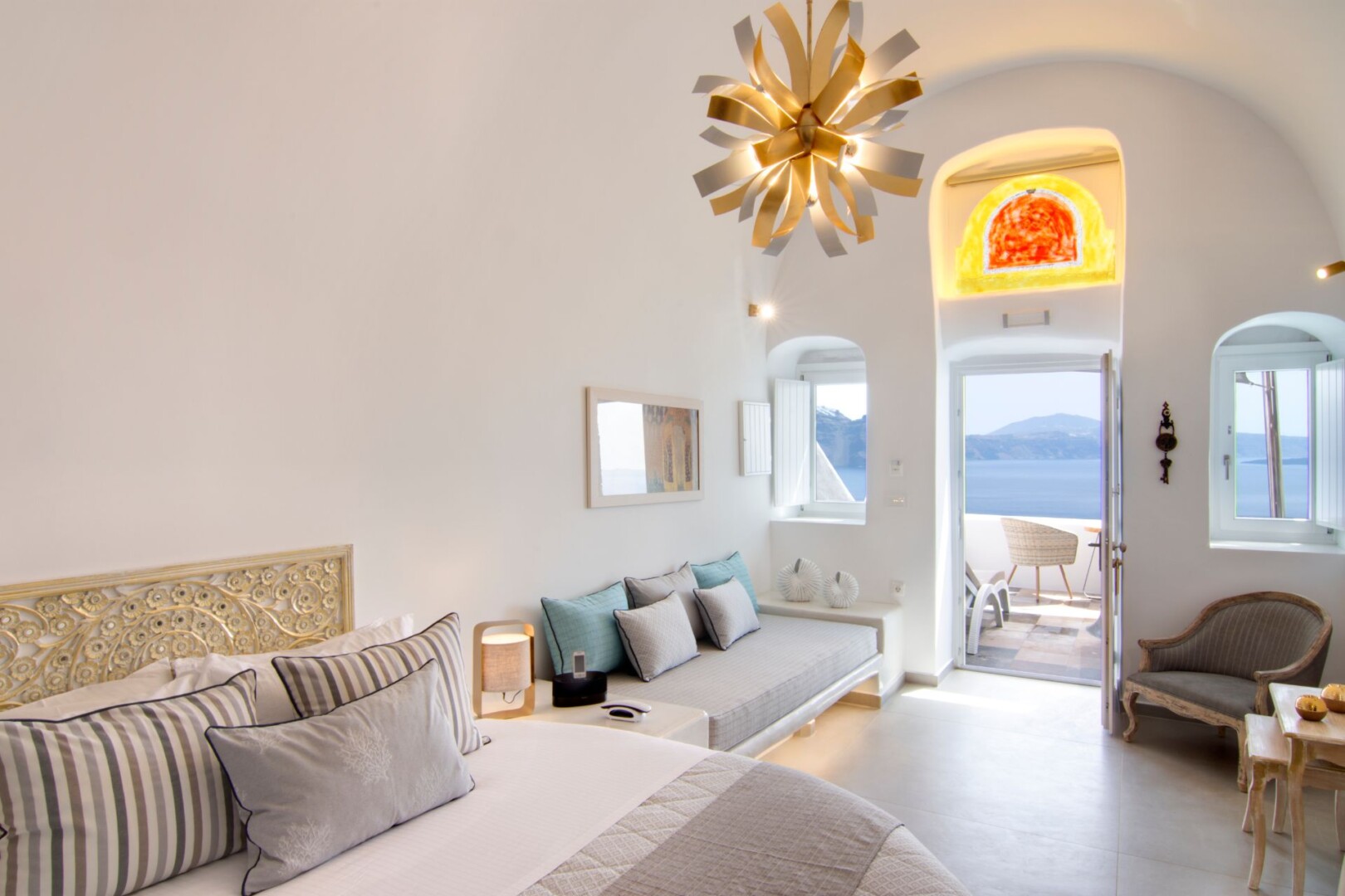 The inner view of the Grande Suite bedroom of our Legend Suites, a collection of Santorini cave suites by Secret Hotels