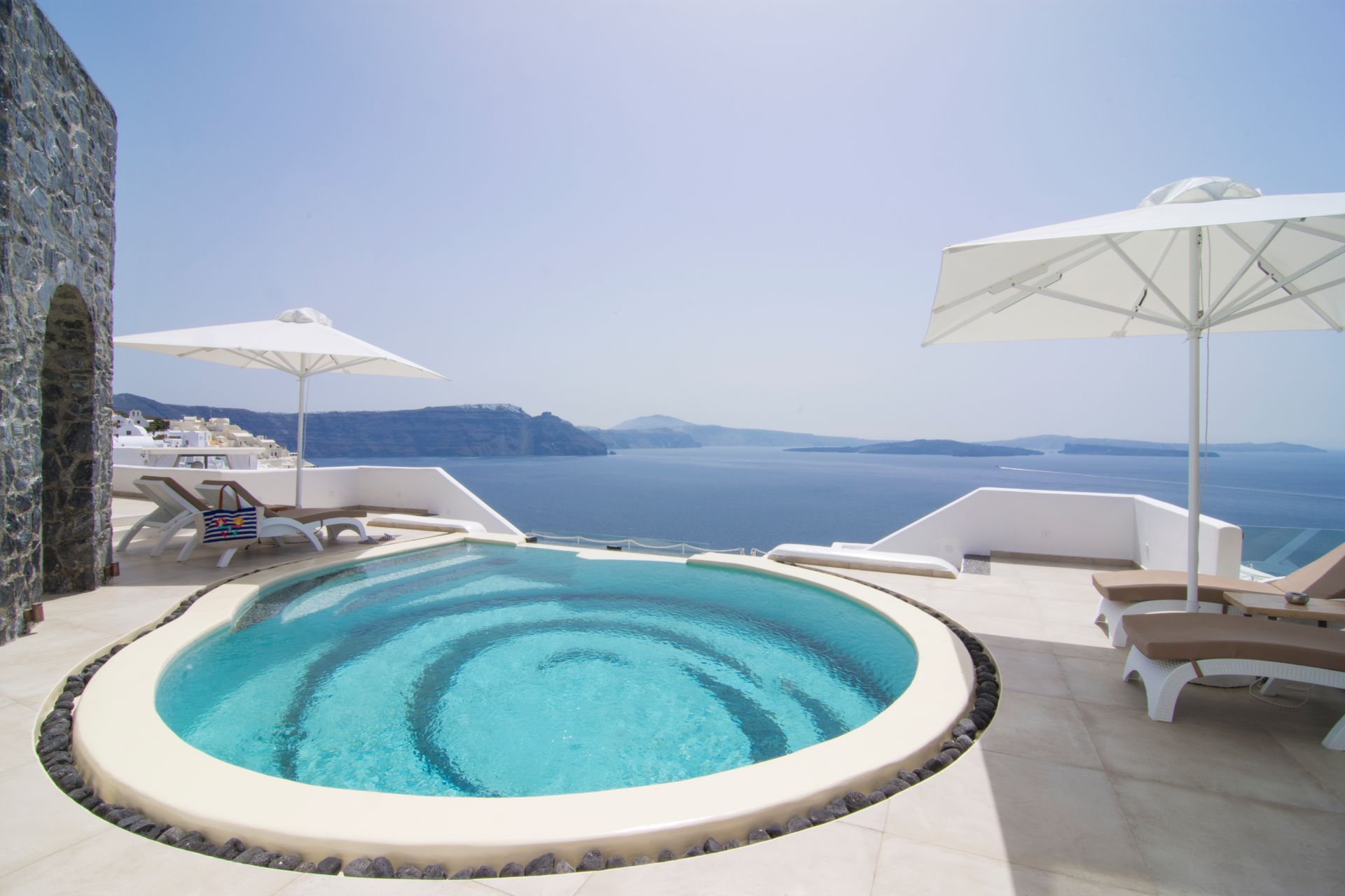The spiral pool at our Santorini Secret Premium, one of the Santorini hotels caldera view by Secret