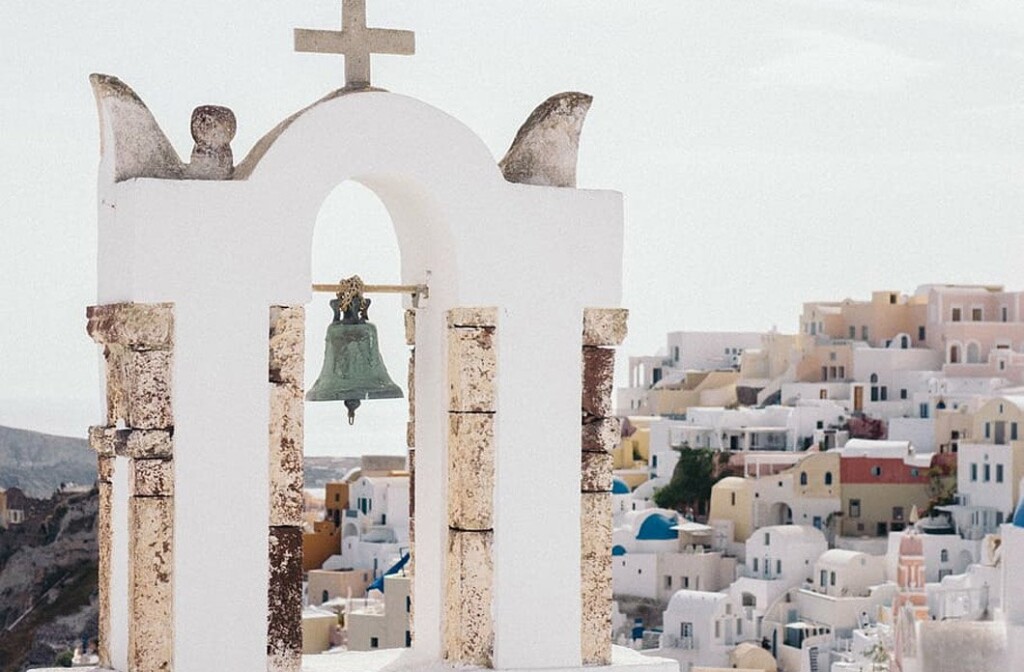 One of the iconic church bell towers of the island that you can discover during your stay at our Santorini luxury hotels by Secret